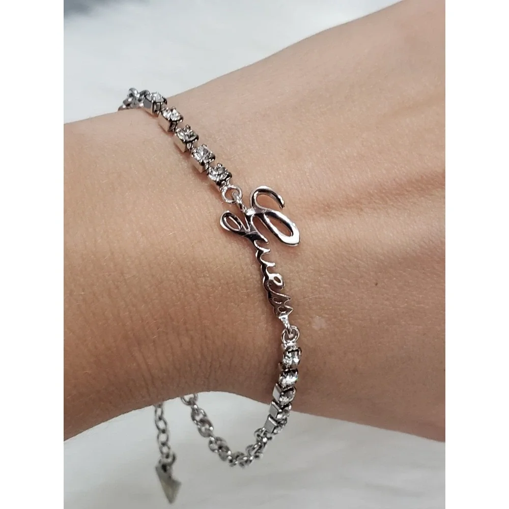 GUESS Clear Crystal Rhinestone Spell Out Logo Silver Tone Bracelet
